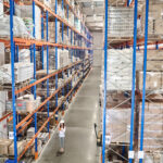 Woman staff member with a tablet managing inventory in efillships expansive 3PL warehouse in Langwarrin, Victoria